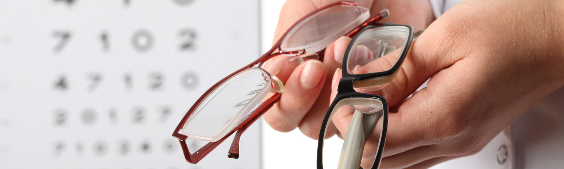 Eye Doctor Displaying Two Glasses